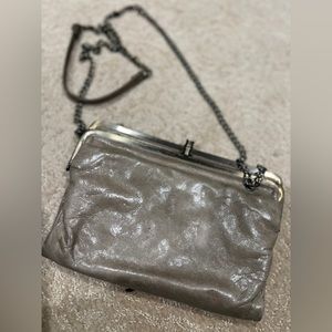 Hobo brand bag with strap lids of organizing and room magnetic sticks together